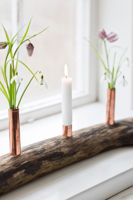 elegante portacandele con tubi in rame